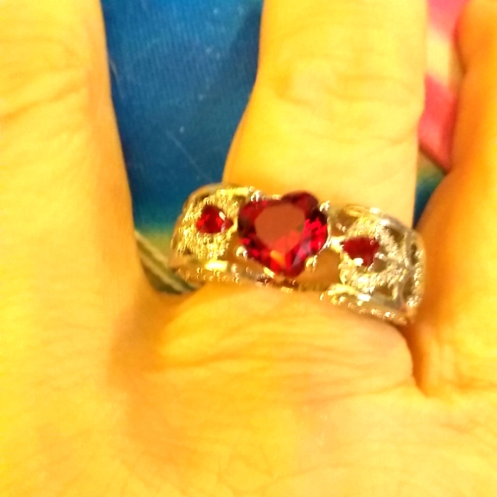 Red CZ Heart in a Silvertone Wing Setting Ring